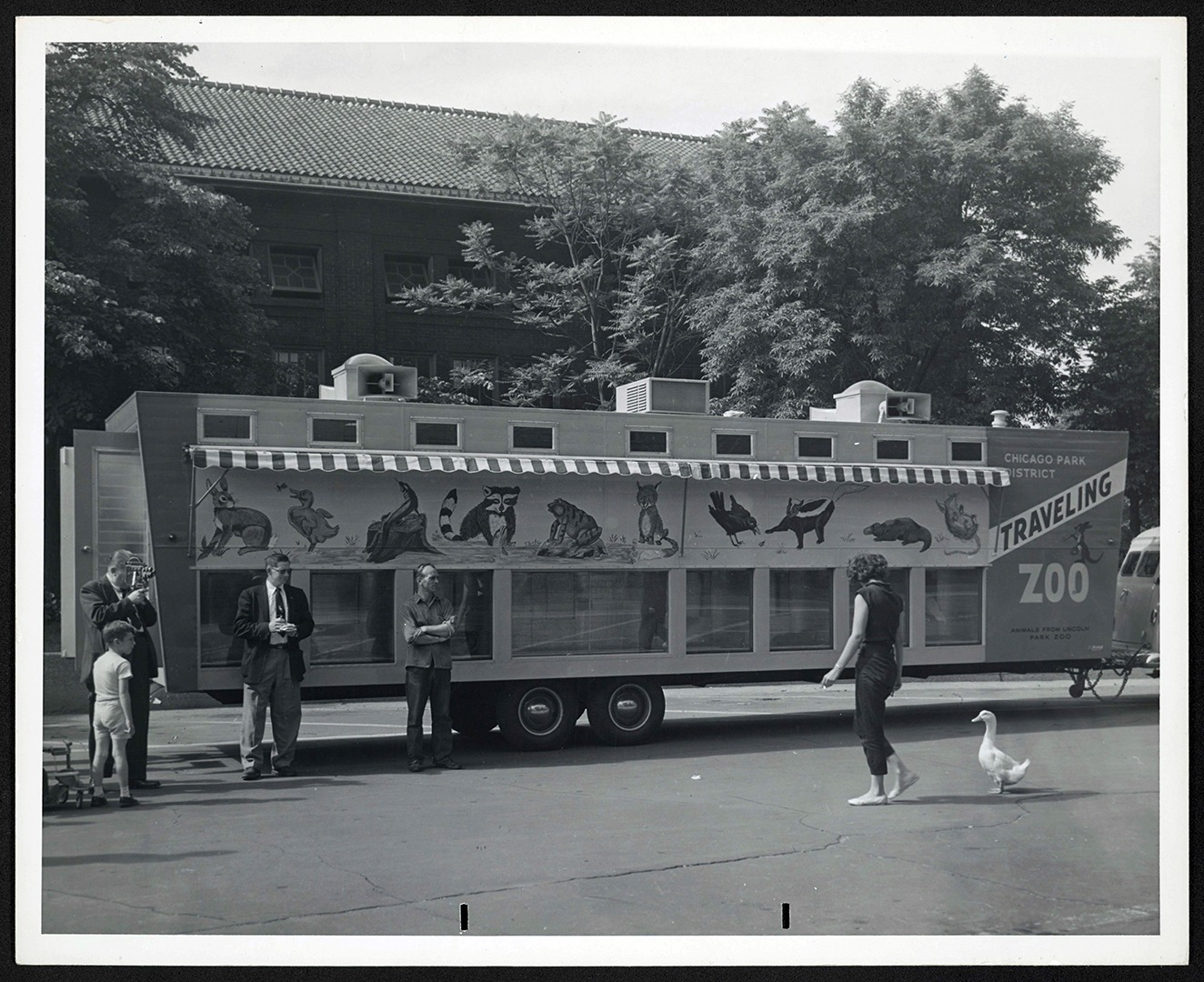 Original traveling zoo trailer parked outside of Lion House