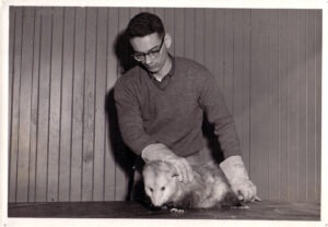 Zoologist Don Nickon with opossum